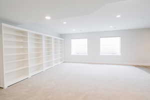 Family room featuring light colored carpet, and recessed lighting