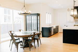 Dining space featuring light wood-style flooring, and recessed lighting