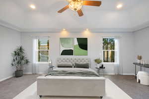 Bedroom featuring crown molding, carpet, and ceiling fan