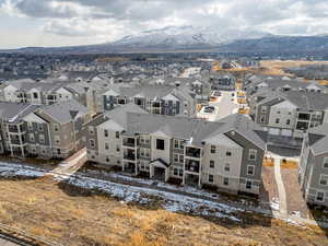 Birds eye view of property with a residential view and a mountain view