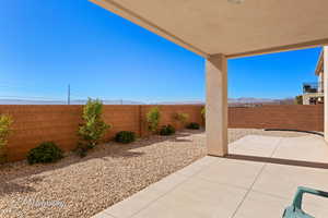 View of patio with a fenced backyard