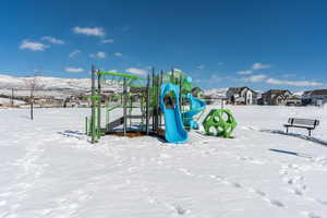 Snow covered playground featuring playground community