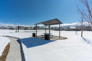 Snowy yard with a residential view