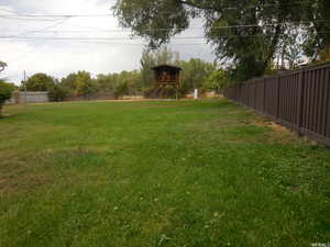 View of yard with a fenced backyard