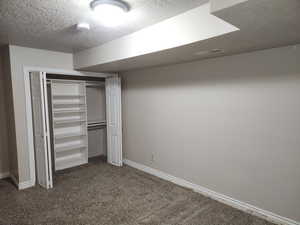 Unfurnished bedroom featuring baseboards, carpet, visible vents, and a closet