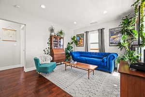 Living room featuring recessed lighting, baseboards, and wood finished floors