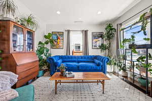 Living area featuring recessed lighting, visible vents, and wood finished floors