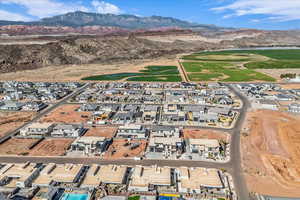 Drone / aerial view with view of golf course and a mountain view