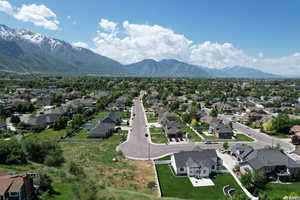 Birds eye view of property with a residential view and a mountain view