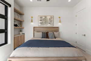 Bedroom with recessed lighting and visible vents