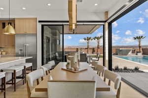 Dining space featuring visible vents and recessed lighting