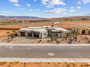 View of front of home featuring an attached garage, a mountain view, and concrete driveway