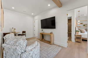 Living room featuring recessed lighting, beamed ceiling, and wood finished floors