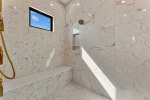 Full bathroom featuring a marble finish shower