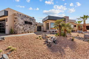 View of front of home with stone siding and stucco siding