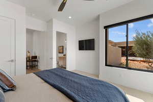 Bedroom with baseboards, ceiling fan, connected bathroom, and recessed lighting