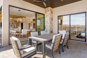 View of patio / terrace with outdoor dining area and a ceiling fan