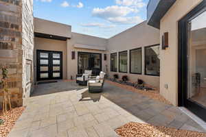 View of patio featuring an outdoor hangout area