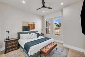 Bedroom featuring baseboards, visible vents, ceiling fan, and recessed lighting