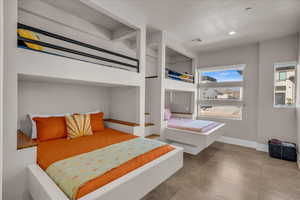 Bedroom with baseboards, visible vents, and recessed lighting