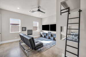 Tiled living area with baseboards, recessed lighting, visible vents, and a ceiling fan