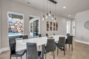 Dining area featuring baseboards, visible vents, and recessed lighting