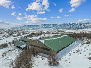 Snowy aerial view with a mountain view