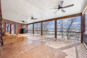 Snow covered patio featuring a ceiling fan and area for grilling