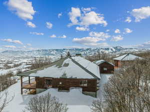 Snowy aerial view with a mountain view