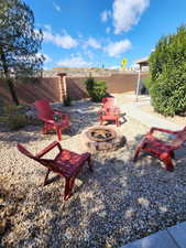 View of patio / terrace featuring a fire pit and fence