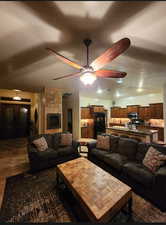 Living room featuring a textured ceiling and a ceiling fan