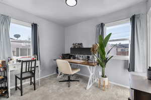 Office space featuring a healthy amount of sunlight and baseboards