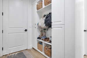 Mudroom with light wood finished floors