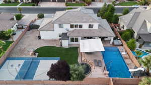 Aerial view of residential area featuring a pool