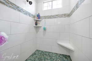 Full bathroom with a tile shower