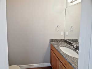 Bathroom with vanity and baseboards