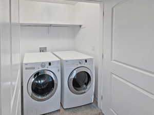 Laundry room with laundry area and separate washer and dryer