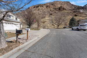 View of road with a mountain view and curbs