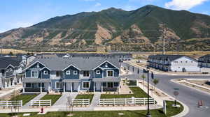 Property view of mountains with a residential view