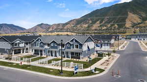 Property view of mountains with a residential view