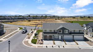 Drone / aerial view featuring a residential view and a mountain view