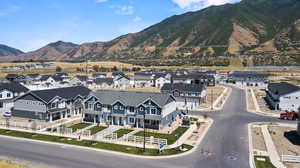 Property view of mountains with a residential view