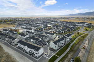 Drone / aerial view featuring a residential view and a mountain view