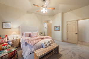 Bedroom featuring ceiling fan, baseboards, and light colored carpet