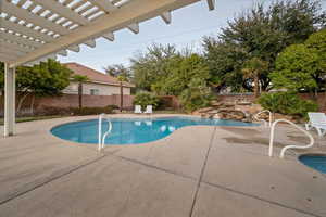 View of pool with a fenced backyard, a fenced in pool, a pergola, and a patio