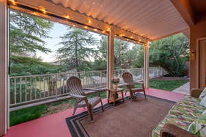 View of patio featuring fence