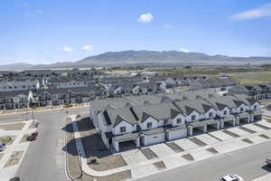 Birds eye view of property with a residential view and a mountain view