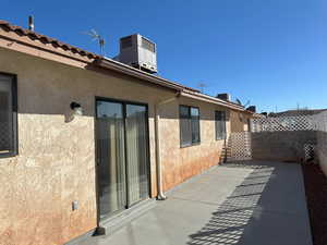 View of patio / terrace featuring fence and cooling unit