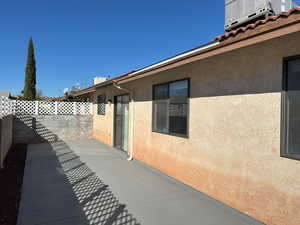 View of patio featuring fence