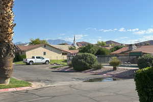 View of road with a mountain view and curbs